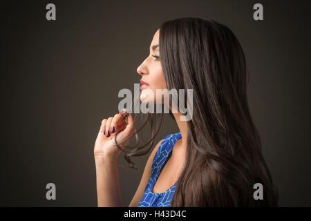 Profile of serious Mixed Race woman Stock Photo