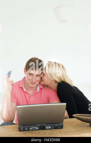 Woman, kiss, man, young, laptop, credit card, Stock Photo