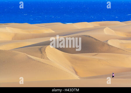 Person walking on sand dunes of Maspalomas, elevated view, Gran Canaria, Canary Islands, Spain Stock Photo