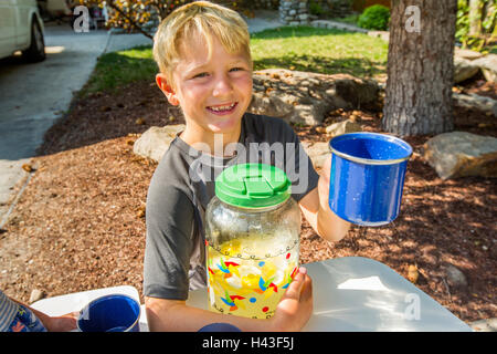 Smiling Caucasian boy posing with lemonade Stock Photo