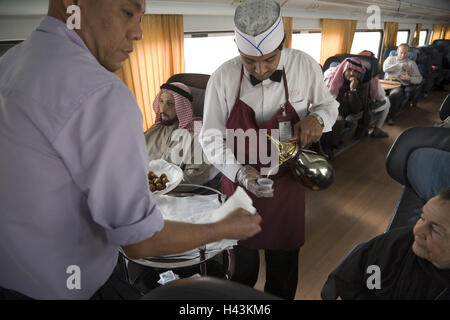 Saudi Arabia, province asch-Scharqiyya, Hofuf, train, compartment, tourist, waiter, serves, tea, Stock Photo