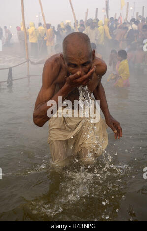 India, Uttar Pradesh, Allahabad, Kumbh Mela, man, ablution, no model release, Stock Photo