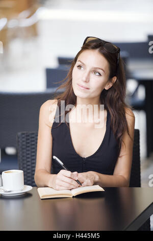 Woman, young, sit, thoughtful, write, model released, people, female, brunette, beauty, concentration, sympathetically, friendly, notes, score, top, black, notch, sunglasses, coffee cup, coffee, outside, portrait, Stock Photo