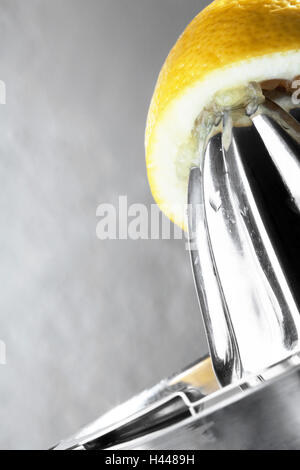 Lemon, halved, juice extractor, close up, Stock Photo