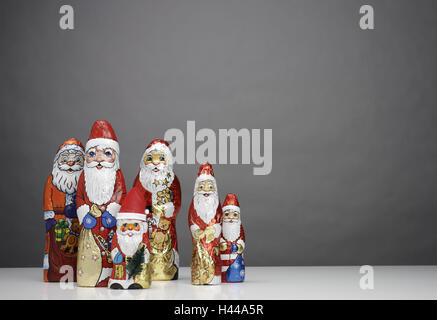 Chocolate Santa Clauses, differently, Stock Photo