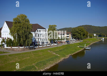 Germany, Weser mountainous country, Bodenwerder, Weser promenade, passer-by, Stock Photo