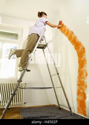 Woman, young, folding conductors, colour role, room, glide, orange, flat, flat change, procession, indent, only, enter, renovation, work, paint, new start, residential property, freehold flat, person, tenant, amateurish, askew, askew, apply, conductor, colour role, wall paint, paintings, Do-it-yourself, whole bodies, inside, Stock Photo