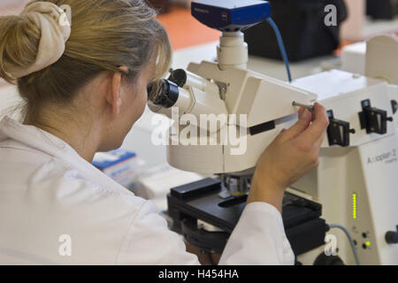Chemicals companies, laboratory assistant, view, microscope, concentration, Germany, North Rhine-Westphalia, Marl, Evonik, company, chemistry, special chemistry, occupation, work, woman, young, people, employee, scientist, light microscope, enlargement, Zeiss, research, laboratory examination, examination, science, analysis, evaluation, industry, technology, Stock Photo