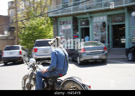 The USA, Arizona, Black Hills, Jerome, street, motorcyclist, mountain village, mine town, ghost town, strangely, tourism, place of interest, building, business, cars, strangely, man, motorcycle, senior, blur, Stock Photo