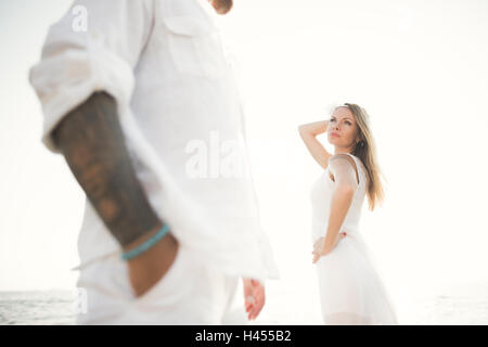 happy just married young wedding couple celebrating and have fun at beautiful beach sunset Stock Photo