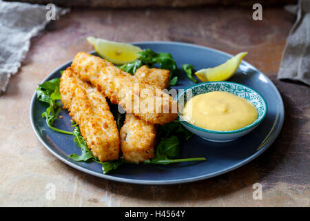 Fish fingers with homemade aioli and rocket salad Stock Photo