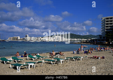 Ibiza, Sant Antoni de Portmany, beach, deck chairs, tourists, Stock Photo