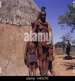 Namibia, Kamanjab, Himba strain, woman, children, Africa, South-West, Africa, person, locals, Himba, tribe, tribe, nut, stand, outside, mucky hut, straw roof, Stock Photo