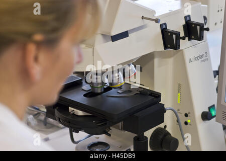 Chemicals companies, laboratory assistant, view, microscope, Germany, North Rhine-Westphalia, Marl, Evonik, company, chemistry, special chemistry, occupation, woman, person, employee, scientist, light microscope, Zeiss, research, laboratory examination, examination, science, lenses, enlargement, analysis, industry, technology, Stock Photo