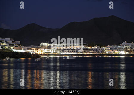 Spain, the Canaries, island Lanzarote, Playa Blanca, harbour view, lighting, evening, holiday's plant, volcano island, the Atlantic, destination, tourism, tourism, architecture, houses, water, sea, mountains, lights, boots, outside, Stock Photo