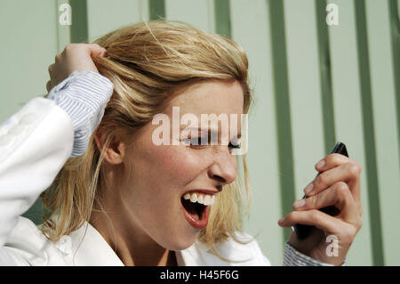 Woman, young, Furiously, facial play, view mobile phone, portrait, side view, Stock Photo