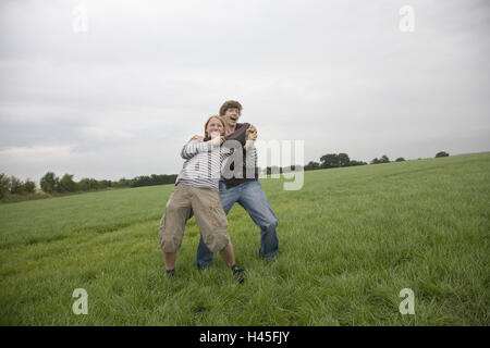 Boys, teenagers, two, meadow, tussle, Stock Photo