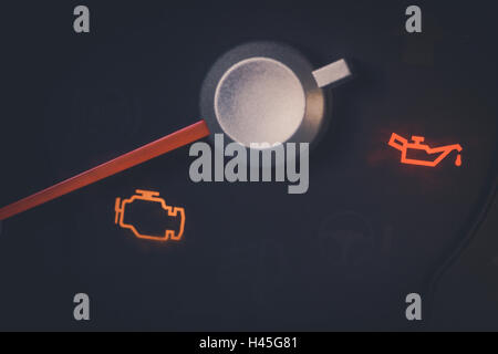 Close up shot of a check engine and oil icons in a car. Stock Photo