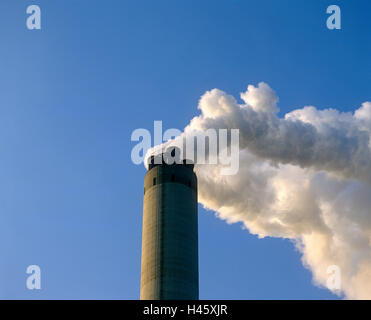 Smoke coming from an industrial tower Stock Photo