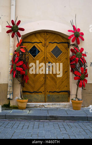 Lithuania, Vilnius, old town, house, detail, entrance, wooden door, flower decoration, Stock Photo