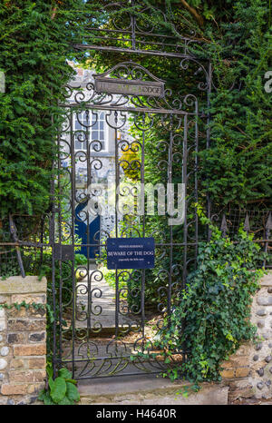 Beware of the dog sign on a metallic gate at private residence. Stock Photo