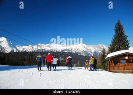 Austria, Tyrol, sea field, Gschwandtkopf, mountain rescue service hut, tourist, skier, Nordtirol, tourist resort, place, tourism, tourism, winter sports area, winter sports, ski runway, snow, architecture, wooden house, wooden hut, hut, person, leisure time, sport, sunny, outside, mountain rescue service, mountains, view, heaven, blue, cloudless, Stock Photo