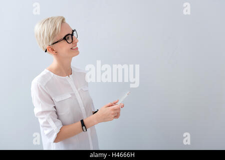 Joyful smiling woman using cell phone Stock Photo