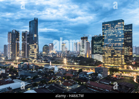 Twilight over Jakarta business district in the Kuningan area in Indonesia capital city. Stock Photo