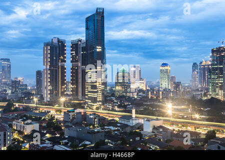 Twilight over Jakarta business district in the Kuningan area in Indonesia capital city. Stock Photo