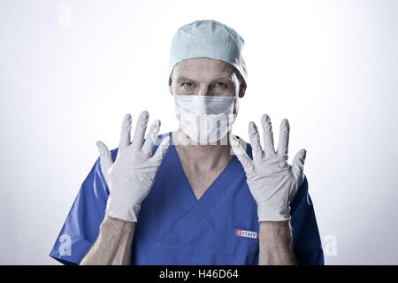 Op. doctor shows hands with gloves, portrait, Stock Photo