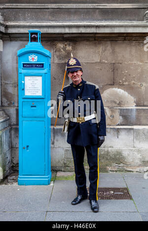 A Man Dressed In An Old Fashioned Policemans Uniform At The Pearly Kings and Queens' Harvest Festival, London, England Stock Photo