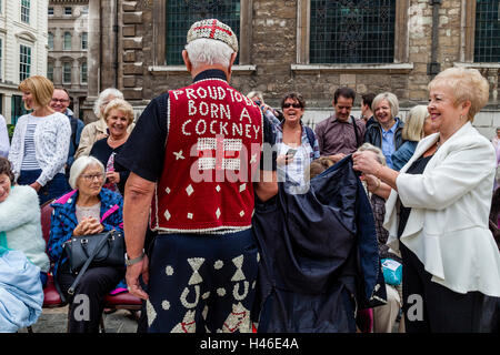 A Proud Pearly King Entertains The Crowd At The Pearly Kings and Queens' Harvest Festival, The Guildhall Yard, London, England Stock Photo