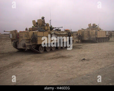 12th April 2003 British Warrior fighting vehicles and an FV4034 Challenger 2 tank on the outskirts of Basra. Stock Photo
