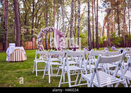Beautiful wedding set up.  ceremony place in the forest Stock Photo
