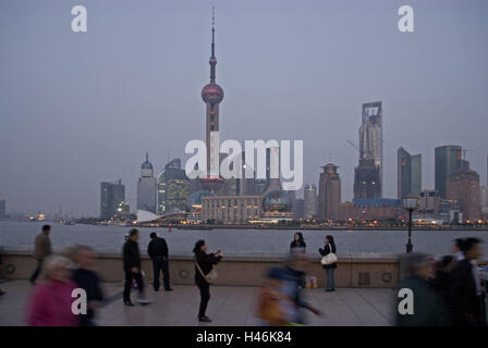 China, Shanghai, Huangpu River, bundle, Pudong, New area, skyline, high rises, offices, hotels, television tower, person, dusk, Stock Photo