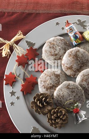 Elisen gingerbread with icing on Christmas plate, Stock Photo