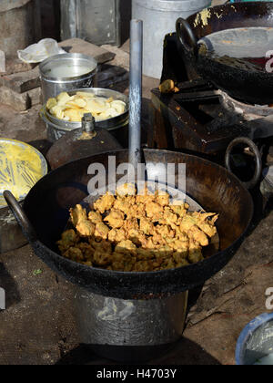 Plain Indian snacks, fried in deep oil sold in the street Stock Photo