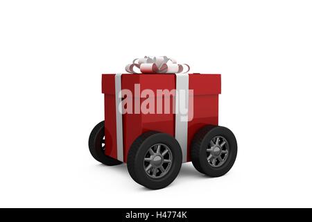 Gift box wrapped in red paper with ribbon on wheels Stock Photo