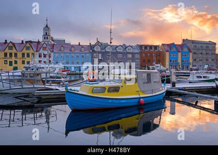 Boats in Torshavn harbour at sunrise, Faroe Islands, Denmark, Europe. Winter (April) 2015. Stock Photo