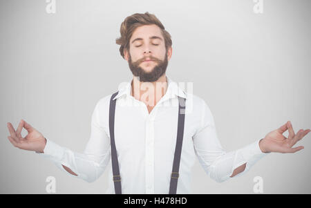 Composite image of hipster meditating arms outstretched Stock Photo