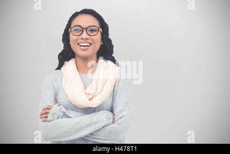 Composite image of asian woman with arms crossed Stock Photo