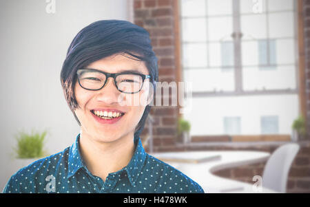 Composite image of smiling hipster businessman looking at camera Stock Photo