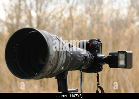 DSLR Camera, reflex camera, telephoto lens, flash, side view, Stock Photo
