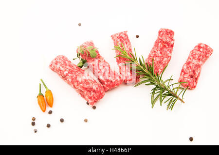 Cevapcici - ready for the grill Delicious meat cevapcici with pepper, rosemary, parsley and garlic, isolated on white Stock Photo