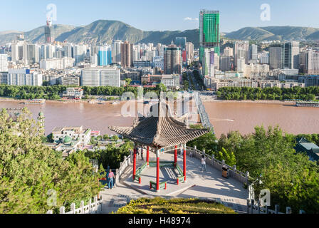 Panoramic view of Lanzhou (China) with a traditional temple in the foreground Stock Photo