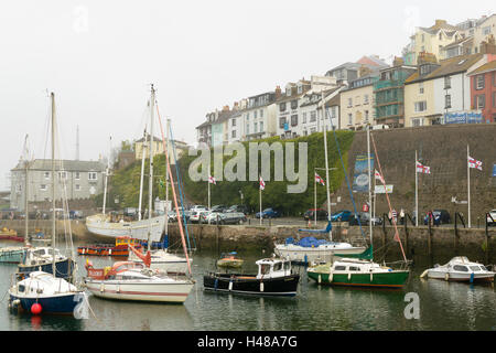 Brixham, Devon, England, UK - 7  September 2016: Boats in the harbor of Brixham on a foggy day in South West England. Stock Photo