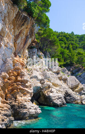 The colorful rocky slopes of the adriatic coast looks inaccessible, Petrovac, Montenegro. Stock Photo