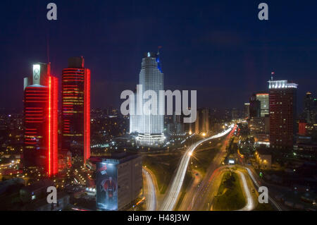 Turkey, Istanbul, Levent, red illuminateded administration building the Sabanci holding company, Is Bankasi, Yapi Kredi Bankasi, IBM Turkey, night, Stock Photo