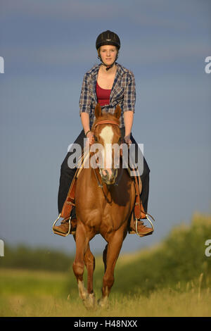 Teenage girl, horse, Paint Horse, back, sit, view camera, Stock Photo