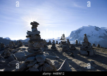 Switzerland, Valais, Zermatt (village), Gornergrat (crest), Monte Rosa massif, cairn, back light, Stock Photo